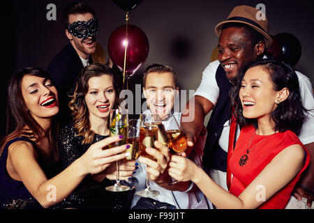 Cheerful people clinking with flutes of champagne Stock Photo