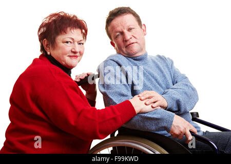 Elderly couple with man sitting in wheelchair Stock Photo