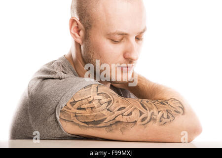 Handsome young man with tattoo, isolated on white. Stock Photo