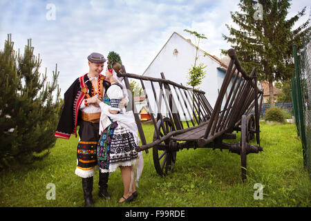 Love couple wearing traditional Eastern Europe folk costumes. Stock Photo