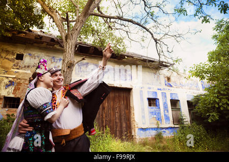 Love couple wearing traditional Eastern Europe folk costumes. Stock Photo