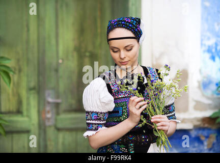 Beautiful woman wearing traditional Eastern Europe folk costumes. Stock Photo