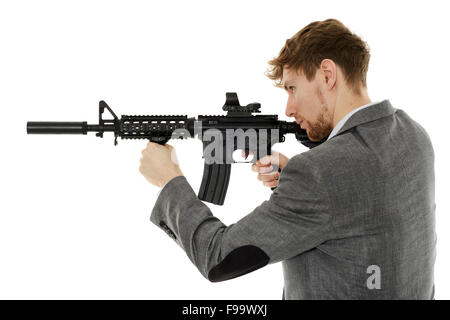 Handsome caucasian guy aiming the machine gun at invisible target isolated on white Stock Photo