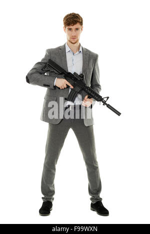 Handsome businessman with machine gun isolated on white Stock Photo