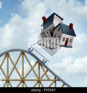 Falling home prices and declining real estate value financial concept as sold houses in a shopping cart going down a roller coaster as a business financial concept as low or lower mortgage residential loan rates and buying your family dream home. Stock Photo