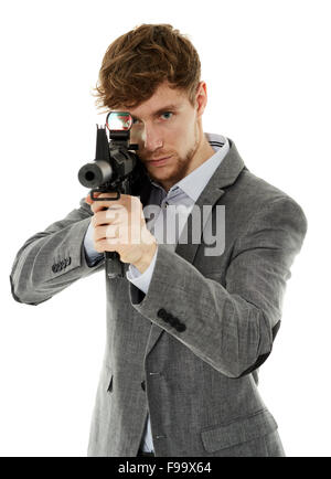 Handsome caucasian guy aiming the machine gun at invisible target isolated on white Stock Photo