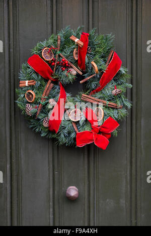 Christmas wreath on a wooden door Stock Photo