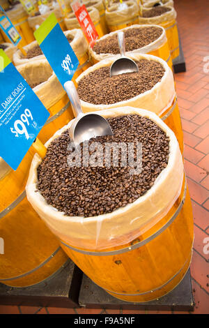 Barrels of coffee beans with scoops for sale in market Stock Photo