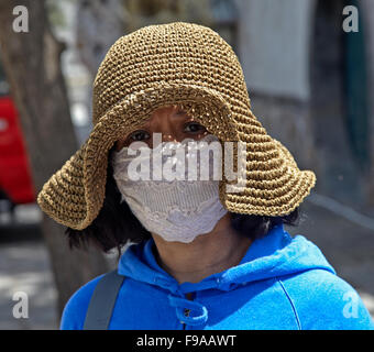 Chinese woman wearing face mask against smog, China Stock Photo