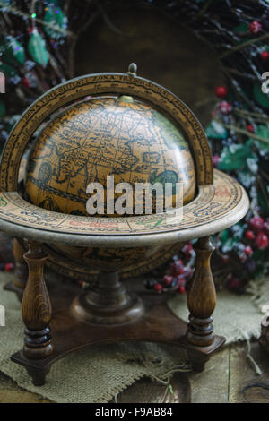 A globe of the world on a Christmas background. Stock Photo