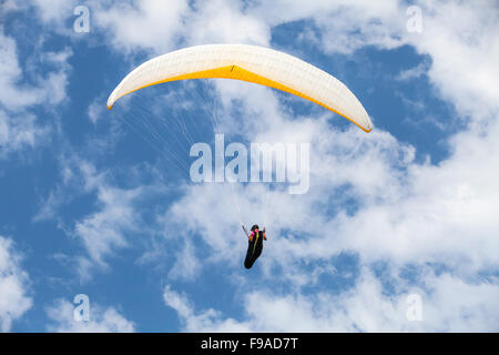 Burgas, Bulgaria - July 23, 2014: Amateur paraglider in blue cloudy sky Stock Photo