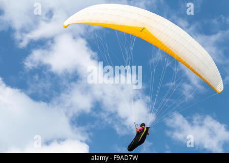 Burgas, Bulgaria - July 23, 2014: Amateur paraglider in blue sky with clouds Stock Photo