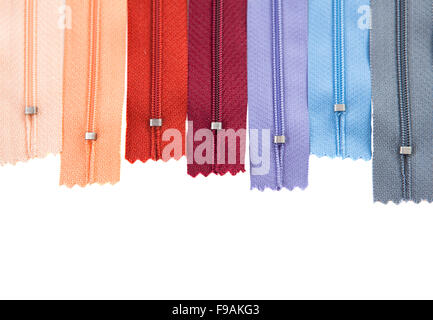 different colorful zippers in front of white background, isolated Stock Photo