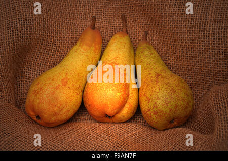 Three pears on jute sack Stock Photo