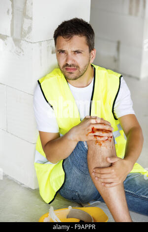 Construction worker has an accident while working on new house Stock Photo