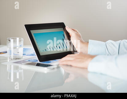 Businessman is reading business graphs and charts Stock Photo