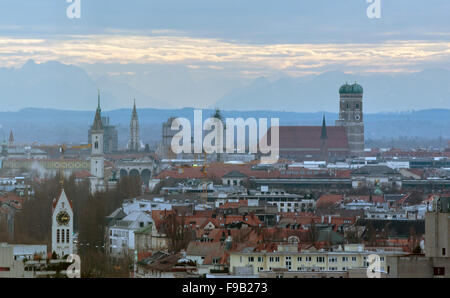 Munich, Germany. 15th Dec, 2015. View of the historic district including the Church of Our Lady in front of the Alps in Munich, Germany, 15 December 2015. Photo: MATTHIAS BALK/dpa (Shot taken through a glas panel)/dpa/Alamy Live News Stock Photo