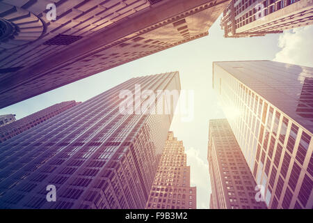 Vintage stylized photo of skyscrapers in Manhattan at sunset, New York City, USA. Stock Photo