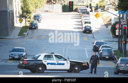 (151215) -- LOS ANGELES, Dec. 15, 2015 (Xinhua) -- A police officer blocks the street near the offices of Los Angeles Unified School District (LAUSD), in Los Angeles, the United States, on Dec. 15, 2015. All LAUSD schools will stay closed today in response to a reported bomb threat, Schools Superintendent Ramon Cortines said. Police said the threat was called in to a School Board member. The threat is involving backpacks and packages left at campuses. The closures applied to all LAUSD campuses, around 900 of them. Los Angeles Unified School District is the second-largest school district in Uni Stock Photo