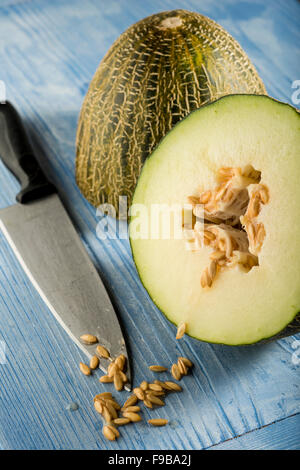 Piel de sapo melon cut in half showing the seeds. Stock Photo