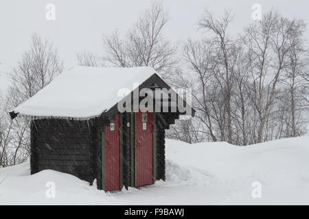 Snowy Public Toilet on the Norway-Russia Border Stock Photo