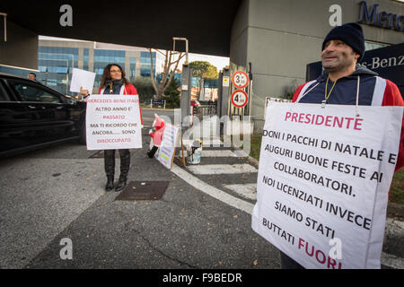 Rome, Italy. 15th Dec, 2015. The former employees of Mercedes Benz bring placard during a protest outside the Mercedes Benz factory in Rome to demand full reinstatement. The workers claim the growth in sales between 2013 and 2015 dispute the company's argument for redundancy. © Andrea Ronchini/Pacific Press/Alamy Live News Stock Photo