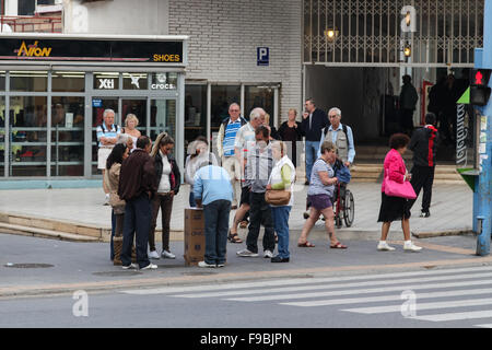 Pea men, peamen, shell men, con men, most of the people in this picture are part of the game to trap tourists in Benidorm Stock Photo