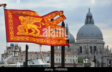 Serenissima Republic of Venice old flag with Salute Basilica in the background Stock Photo