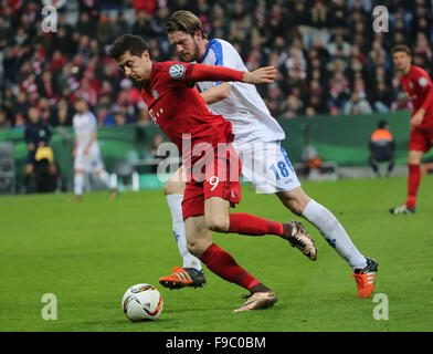 Munich, Germany. 15th Dec, 2015. Robert Lewandowski (L) of Bayern Munich vies with a player of Darmstadt during the German Cup (DFB Pokal) third round match in Munich, Germany, Dec. 15, 2015. Bayern Munich won 1-0. © Philippe Ruiz/Xinhua/Alamy Live News Stock Photo