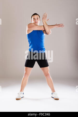 Young handsome man with perfect body in sport clothes. Stock Photo