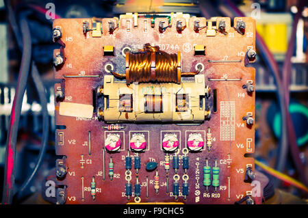 vintage dirty components old on electronic board Stock Photo