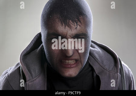 Dangerous man in mask is isolated on background Stock Photo