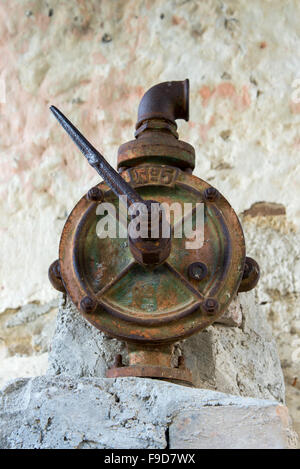 authentic old rusty faucet in a water column Stock Photo