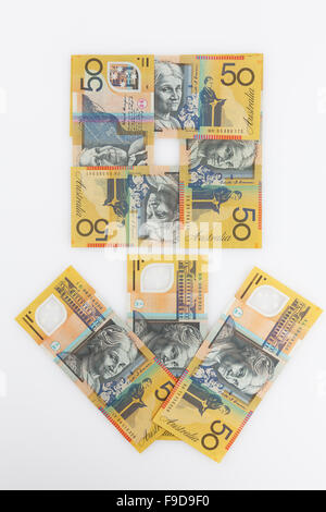 50 Australian dollars banknotes arranged in form of flower isolated on white Stock Photo