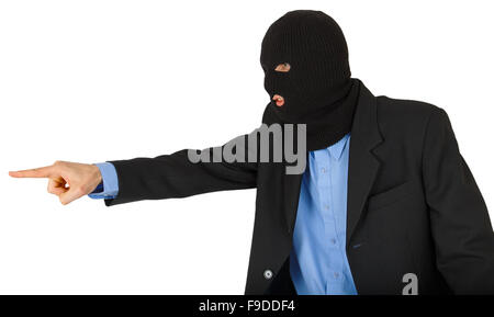 Thief in black mask in suit pointing with his finger isolated on white background Stock Photo
