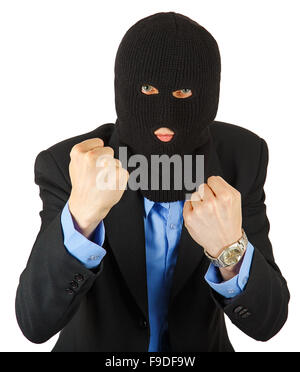 Thief in black mask in suit holding his fists isolated on white background Stock Photo