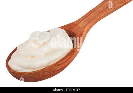 Handful of mayonnaise in wooden spoon isolated on a white background Stock Photo