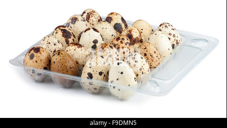 Quail eggs in a transparent plastic container isolated on white Stock Photo