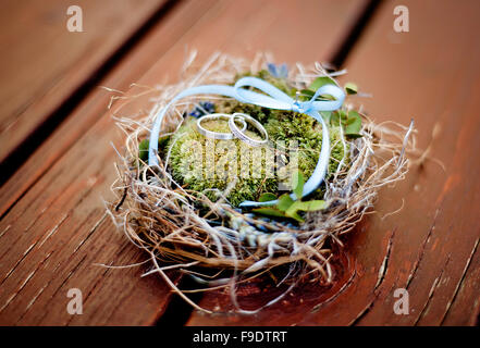 Wedding rings in decorated nest Stock Photo