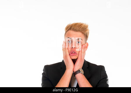 Close-up portrait of a handsome young man in a business suit on white background Stock Photo