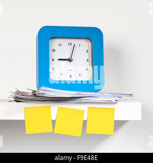 Many sticky notes stuck on the clock. Stock Photo