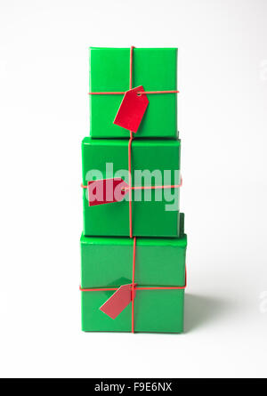 Overhead shot of multiple simple, lidded boxes tied with red