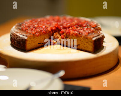 Healthy gluten free Clementine and pomegranate cake. Stock Photo