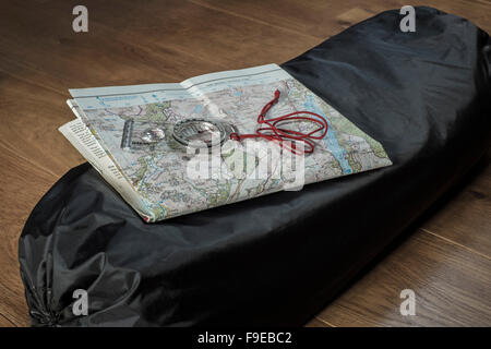 Map, compass and tent. Stock Photo