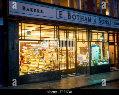 Window of Elizabeth Botham's Bakery and Cake Shop in Whitby with traditional bread and cakes evening light Stock Photo