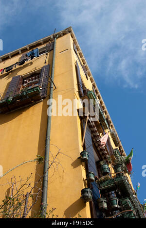 Yellow building and blue sky from a low angle Stock Photo