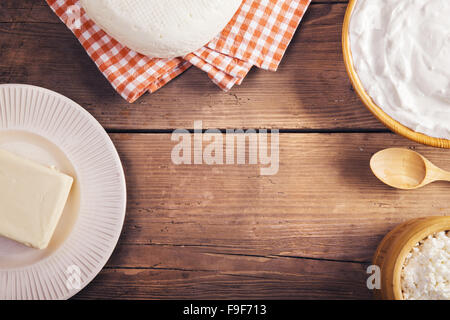 Variety of dairy products laid on a wooden table background Stock Photo