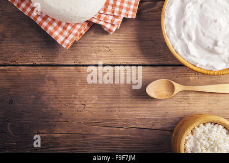 Variety of dairy products laid on a wooden table background Stock Photo