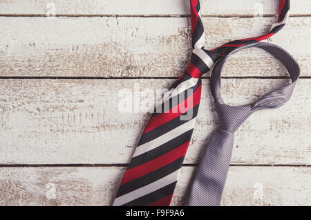 Fathers day composition of two ties laid on wooden floor background. Stock Photo