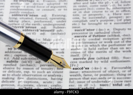 Fountain pen showing the word Success in a dictionary Stock Photo